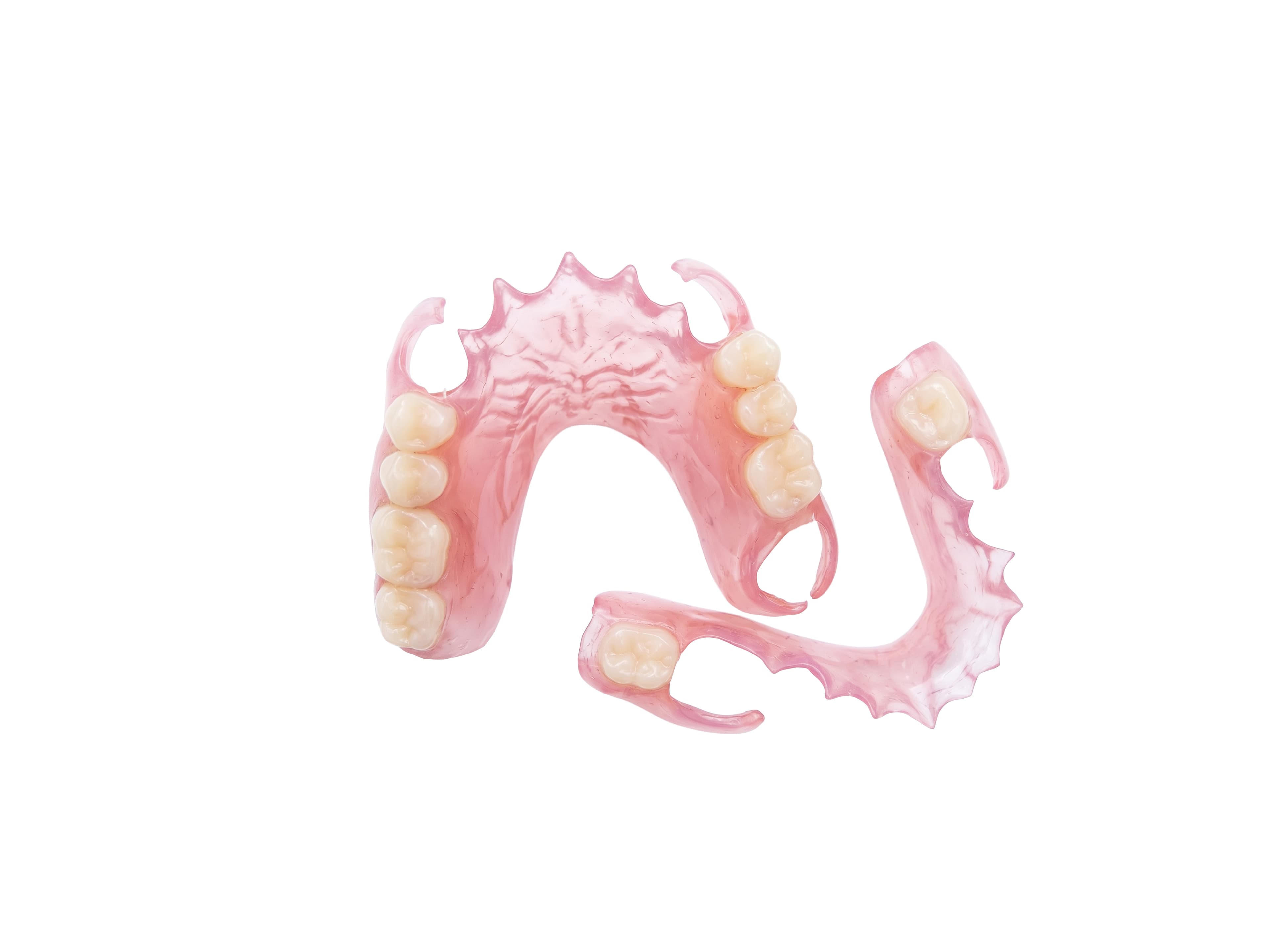 Two pink flexible partial dentures